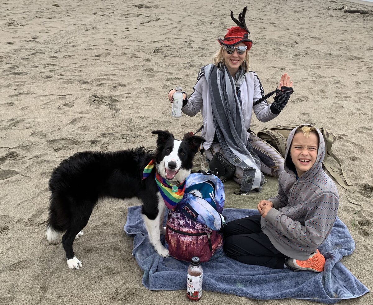 Naomi, Calvin, and Bodhi on the beach